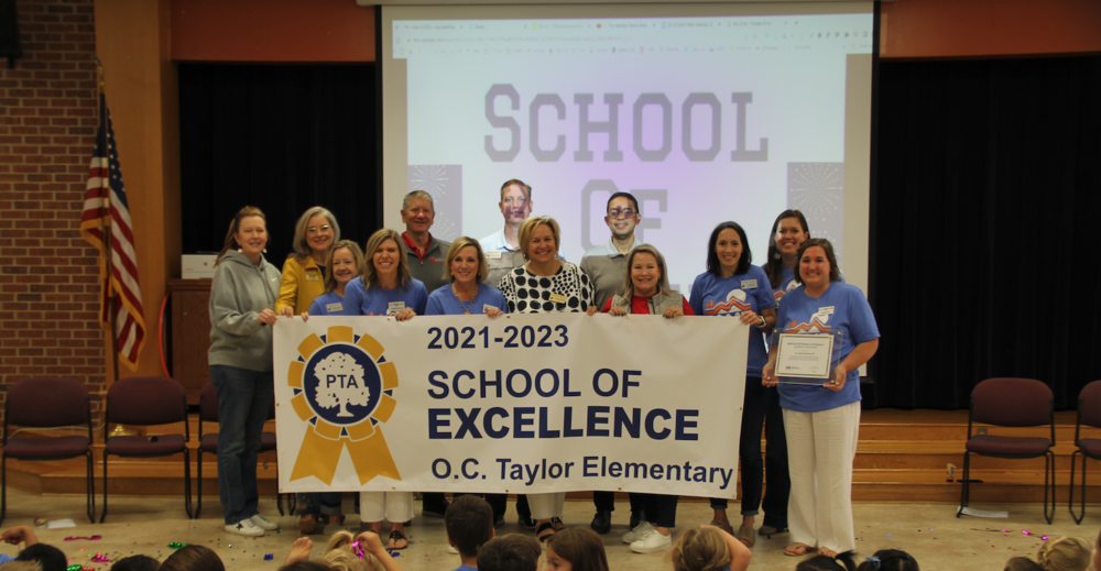 oc taylor pta behind a banner