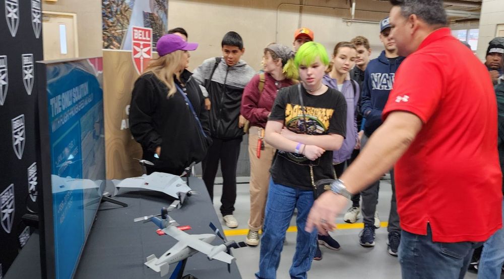students looking at drones 